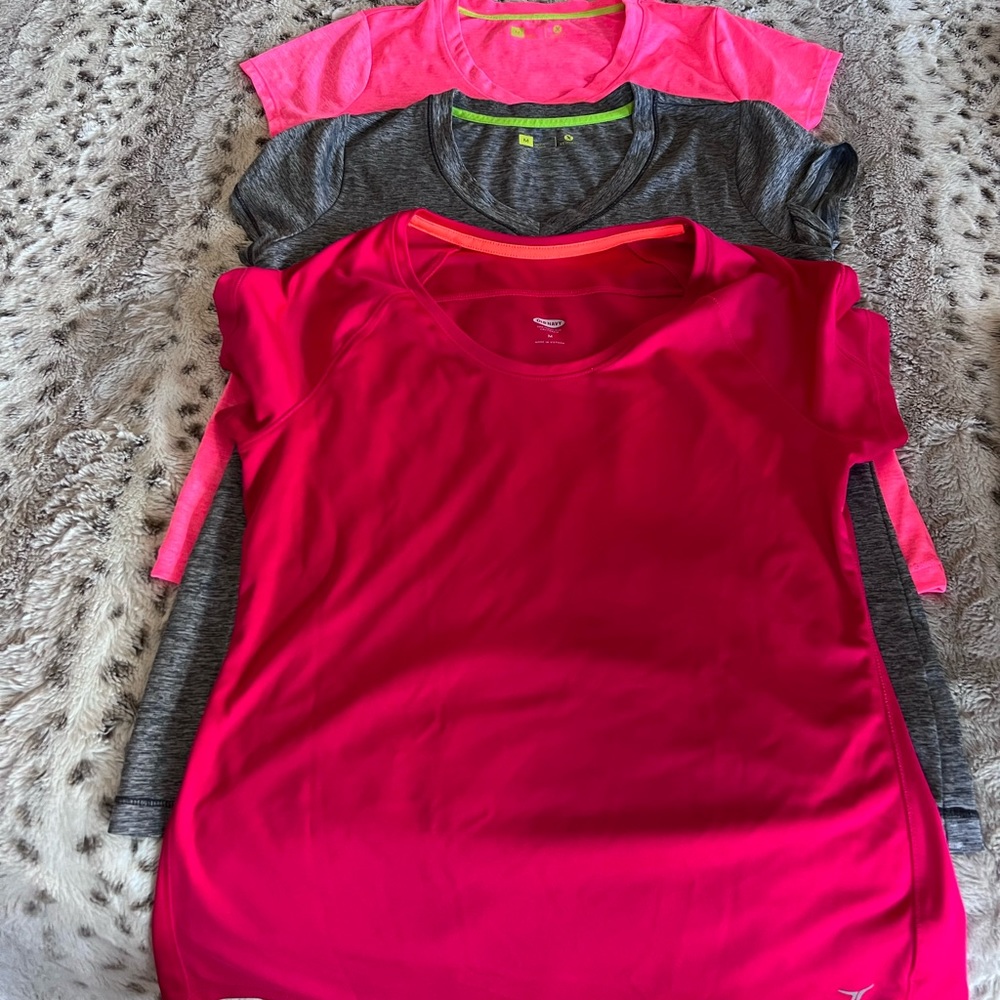 A bundle of three work out T-shirts